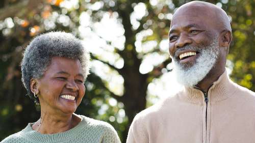 couple with tooth replacement smiling in Huntsville, AL