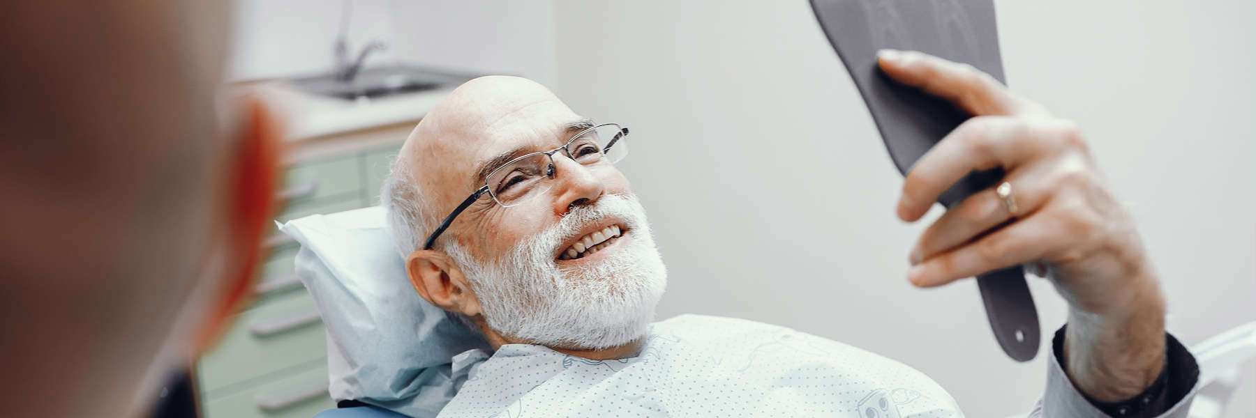 patient at Dr. Doug Booth DDS after tooth replacement procedure in Huntsville