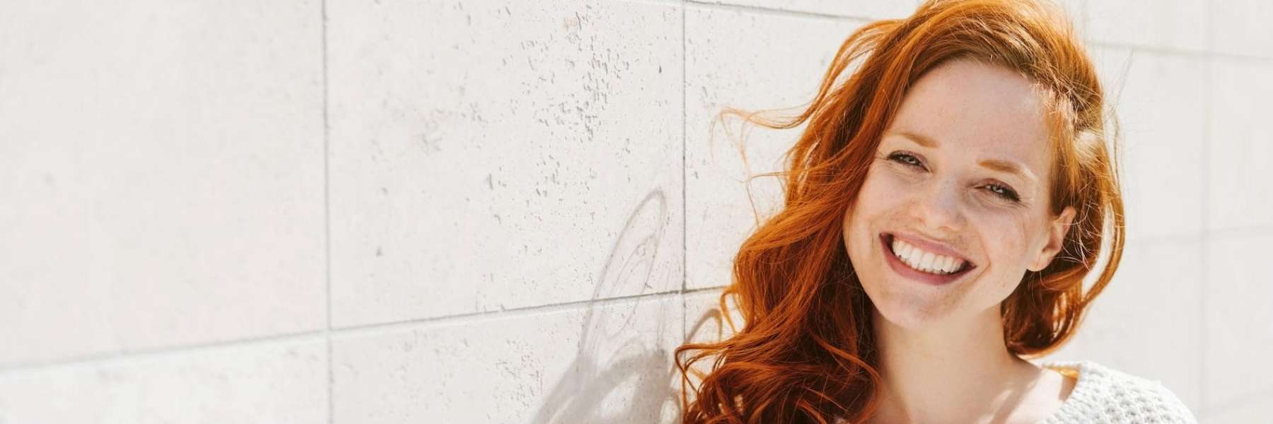 woman smiling after cosmetic dentistry in huntsville