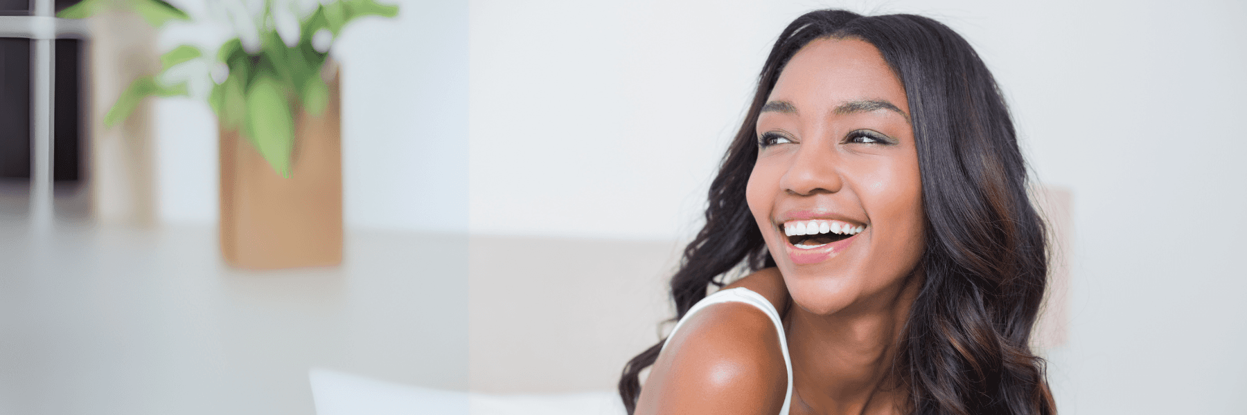 woman smiling after teeth whitening in huntsville